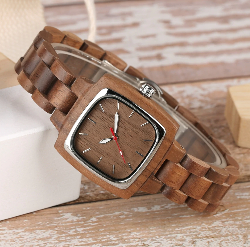 his and her wood watches-tilted on shelf