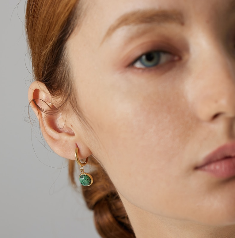 gold hoop earrings on girl